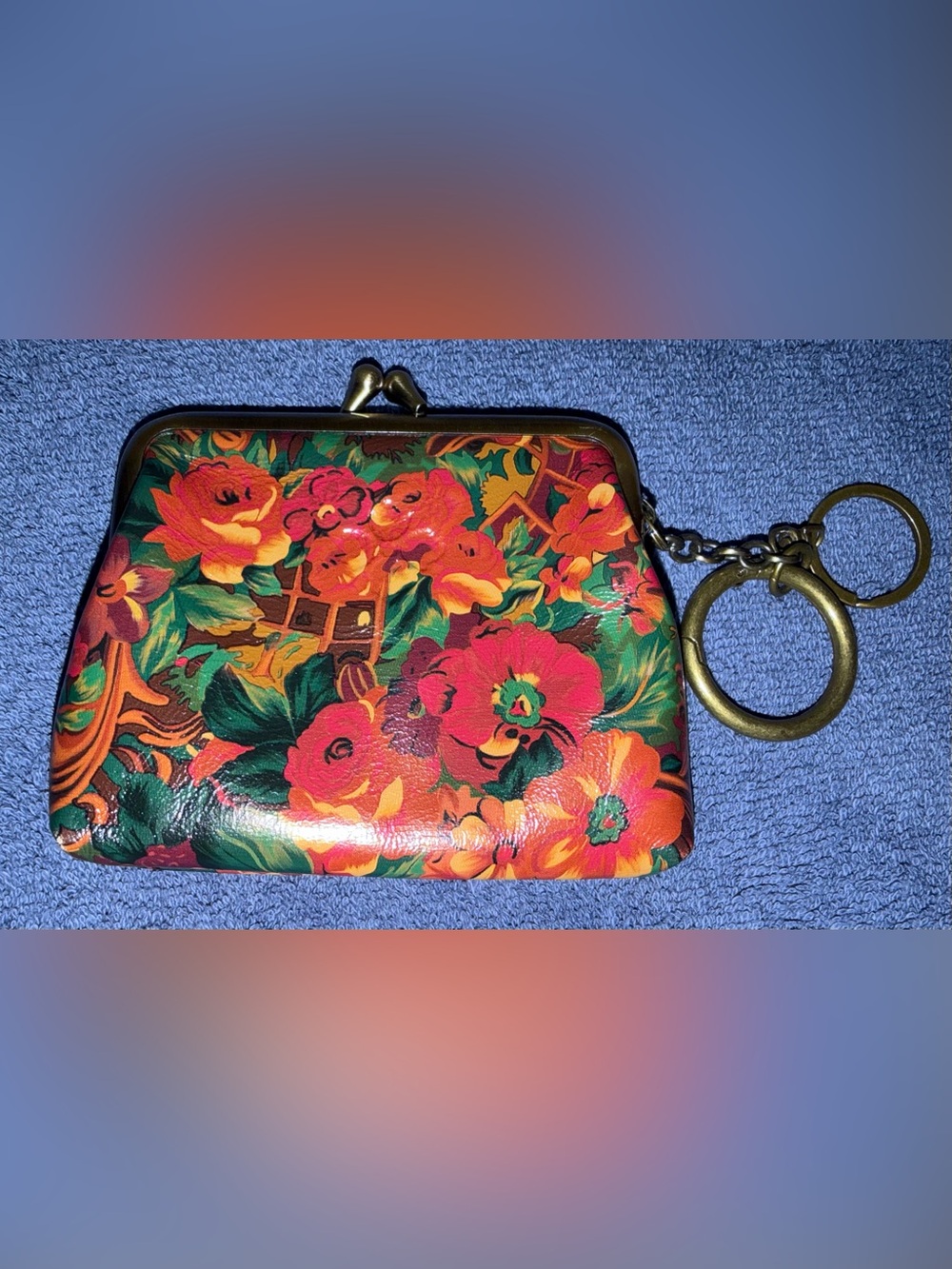 Patricia Nash kiss lock coin purse in vibrant colors called “Rustic Nature”.